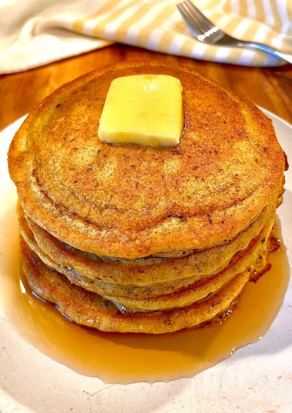Pumpkin pancakes with butter and maple syrup