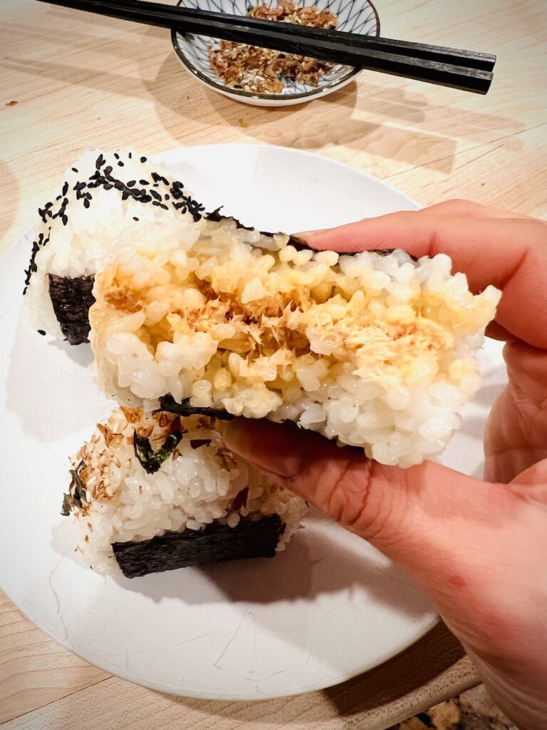 Inside view of onigiri with spicy salmon filling