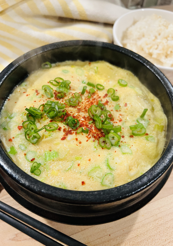 Korean Steamed Eggs topped with green onion and red chili pepper