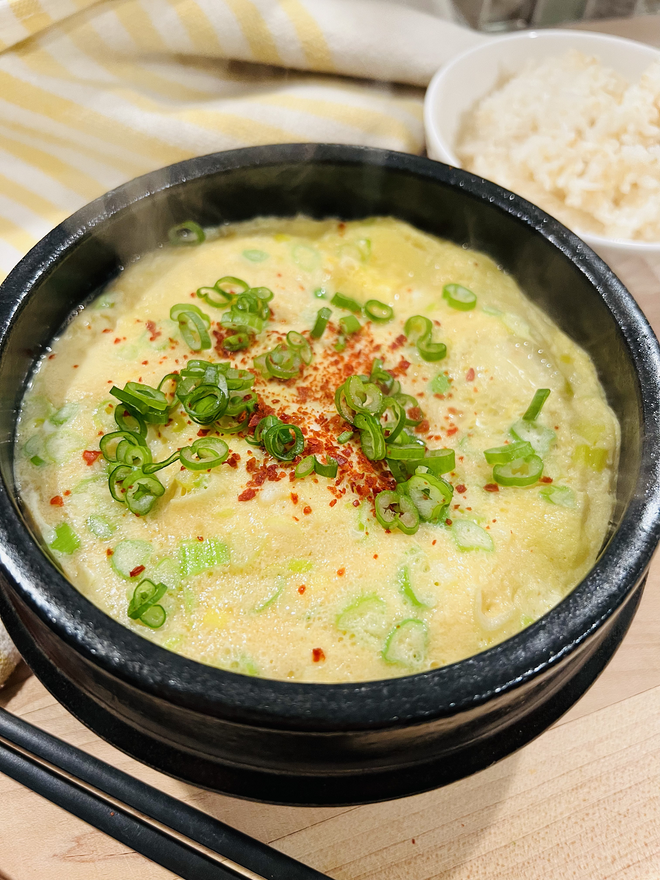 Korean Steamed Eggs topped with green onion and red chili pepper