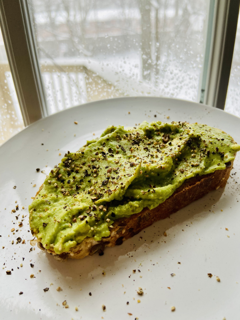 mashed avocado on toast with black pepper