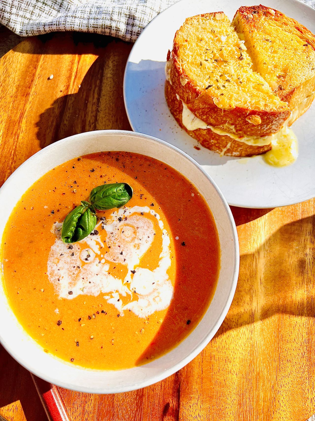 Bowl of tomato soup with grilled cheese