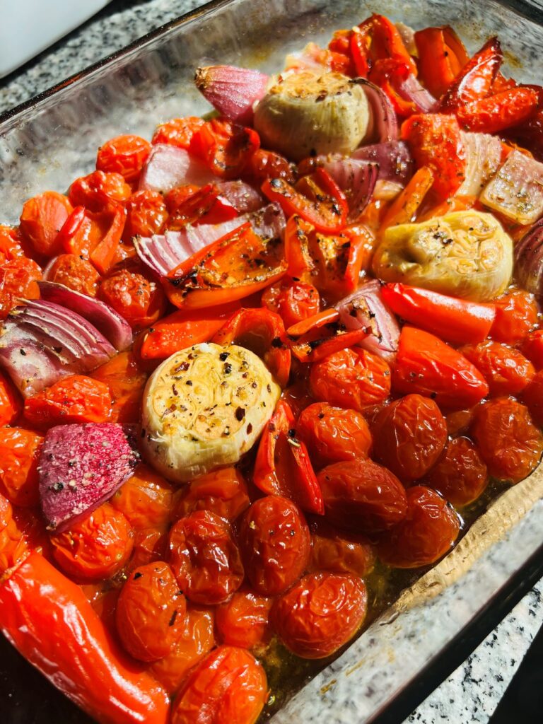 pan of roasted tomatoes and vegetables
