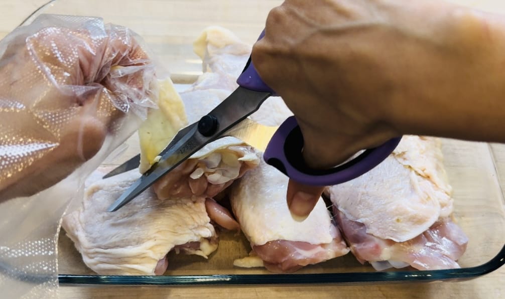 cut the fat off the chicken with kitchen shears
