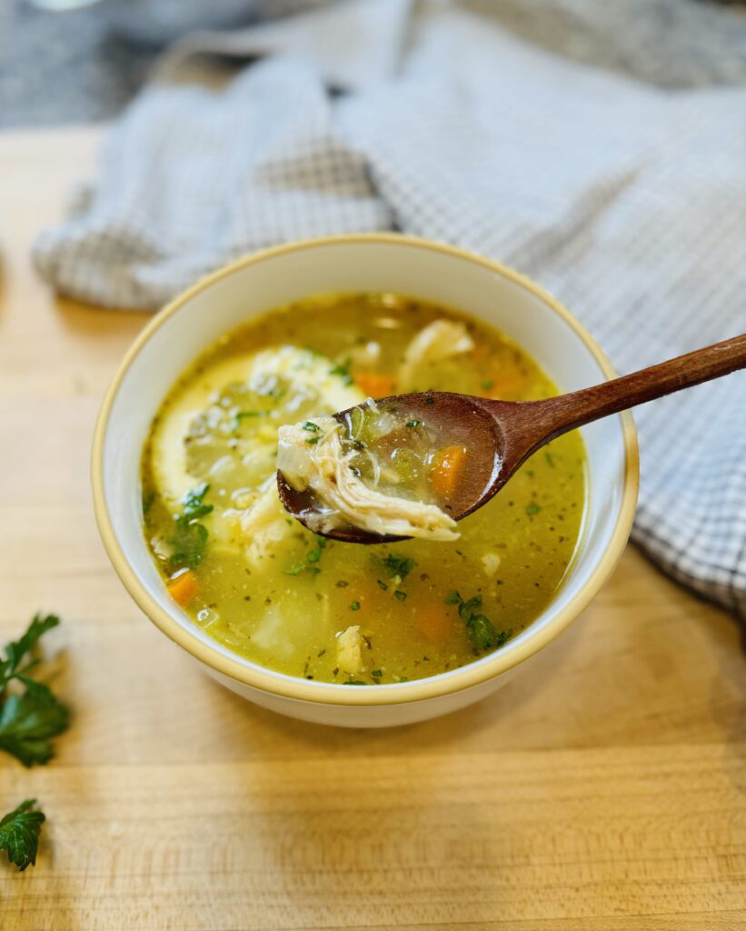 lemon chicken soup served with spoon