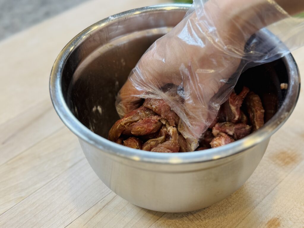 Marinating the beef with other ingredients in a small bowl