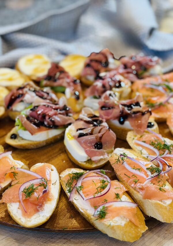 A shot of 3 Easy Crostini Recipes in a wood plate.