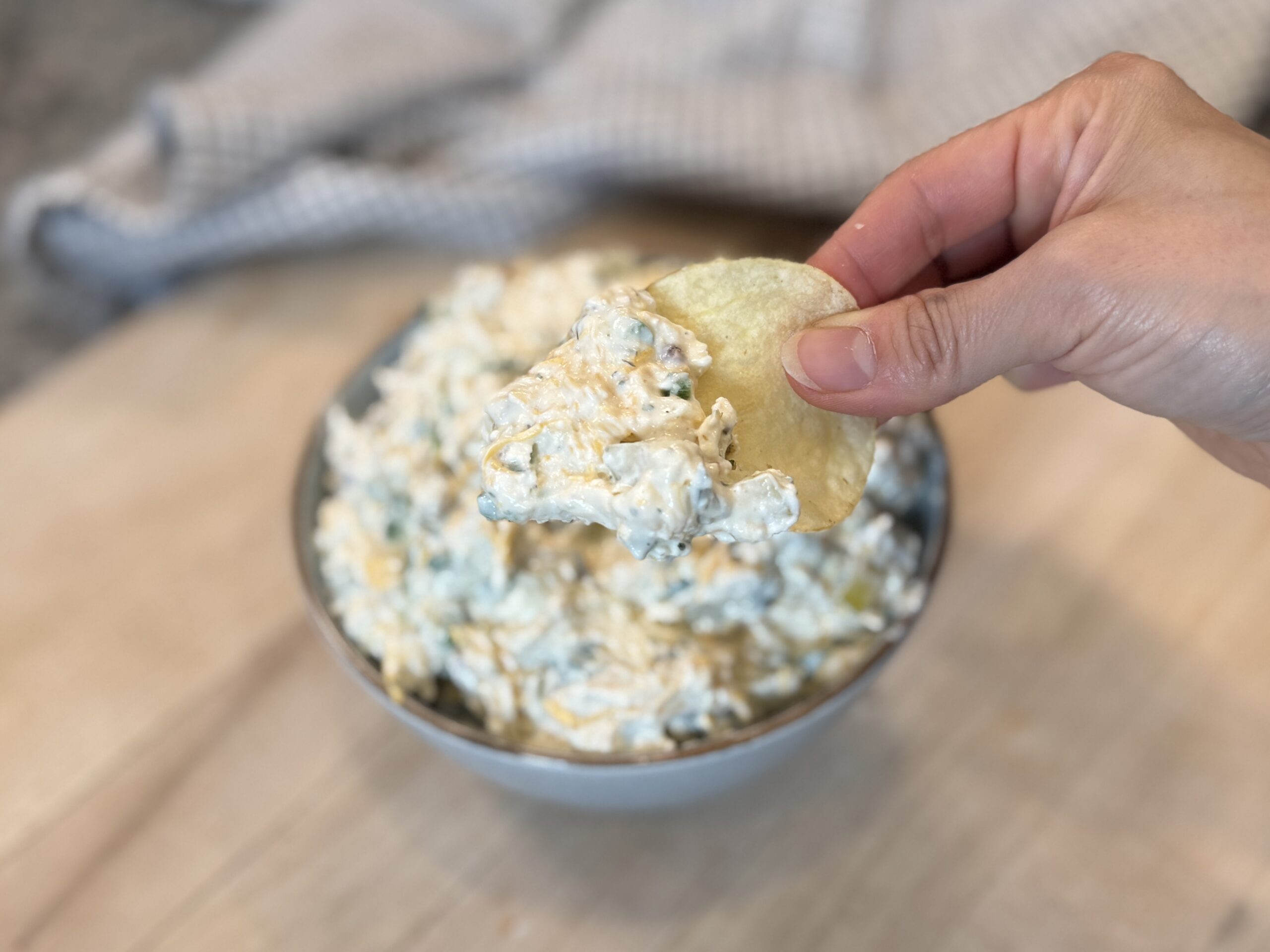 A shot of chip dipping on the Pickle dip.