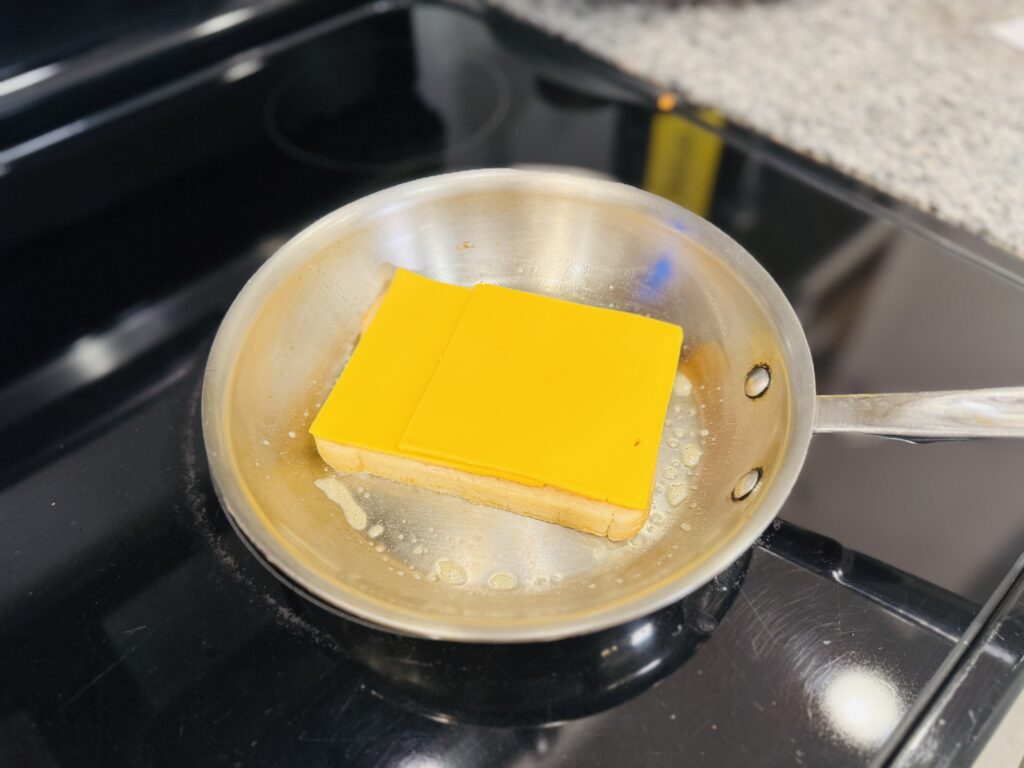 American cheese slices placed over toasted sourdough bread