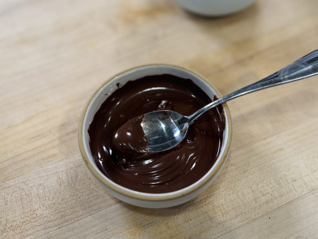 Close up of melted chocolate for the magic shell topping