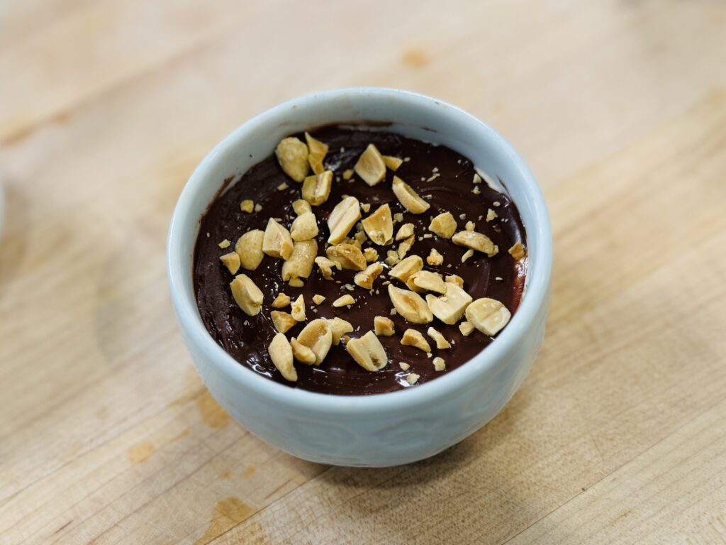 Finished high protein magic shell yogurt with hardened chocolate shell
